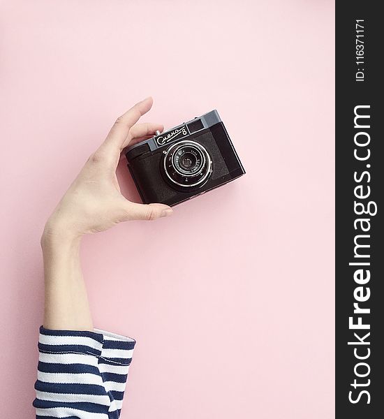 Person Holding Black Point-and-shoot Camera
