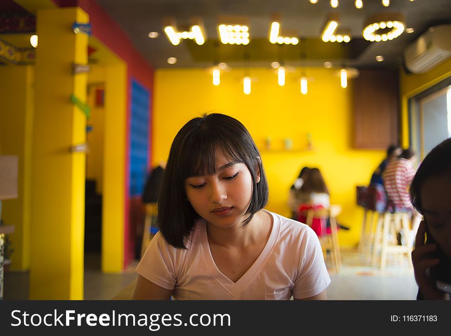 Selective Focus Photography Of Woman Wearing Pink V-neck Shirt