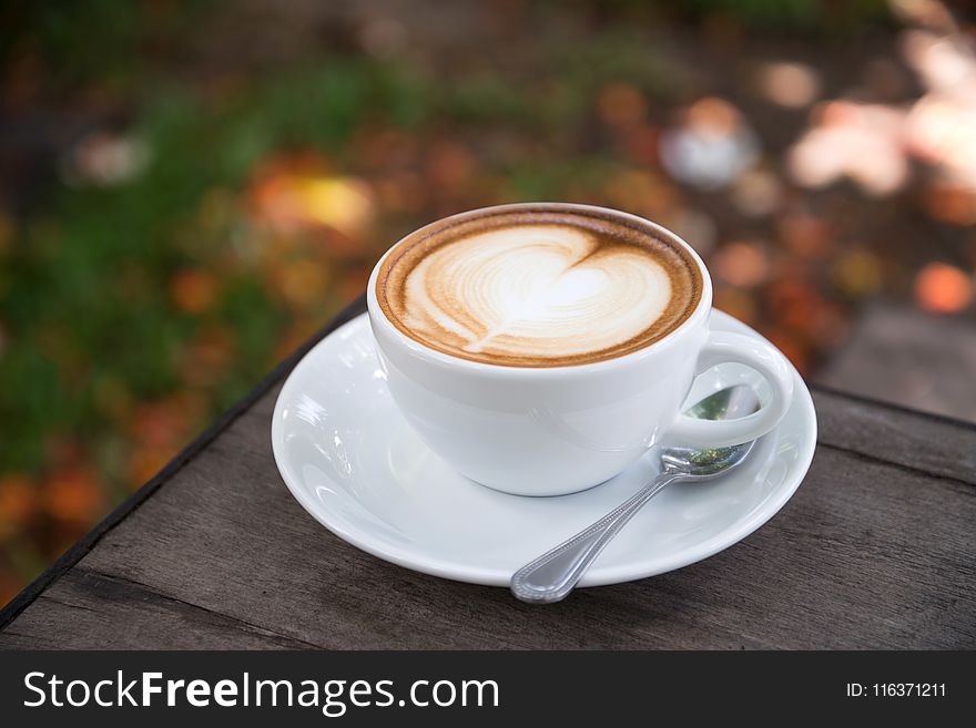 Photo of Coffee Latte on Wooden Table Top