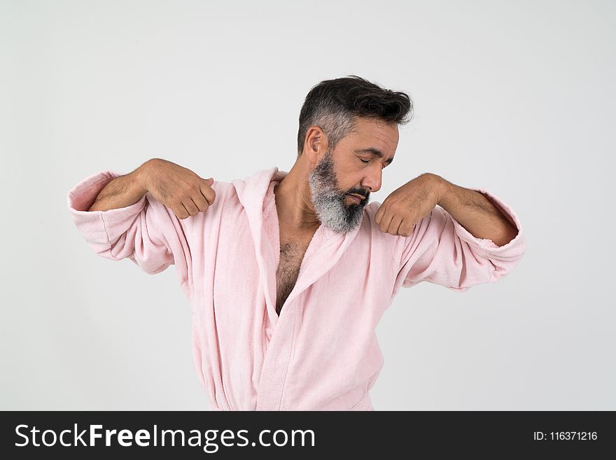 Man Wearing Pink Bathrobe With Both Hands on Shoulder