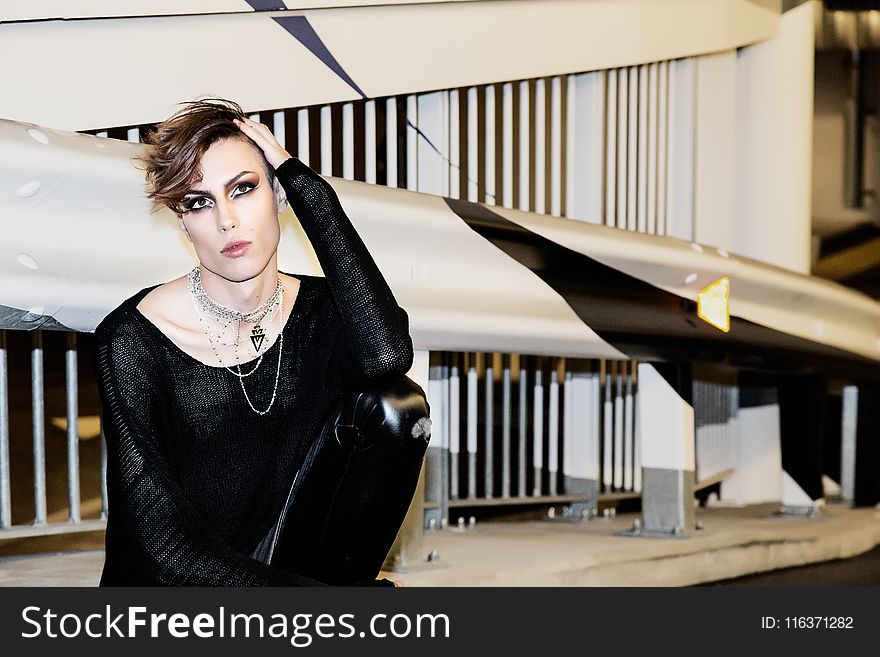 Woman Wearing Black Long-sleeved Shirt Near Grey And Black Wall