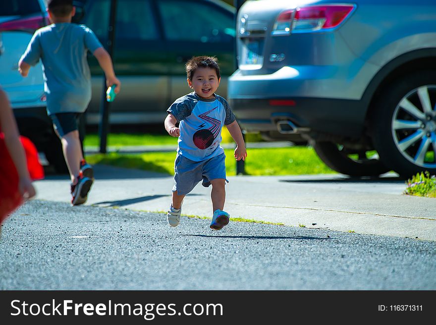 Photography of a Kid Running