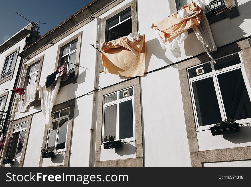 Clothes Hanged on Wire Beside House