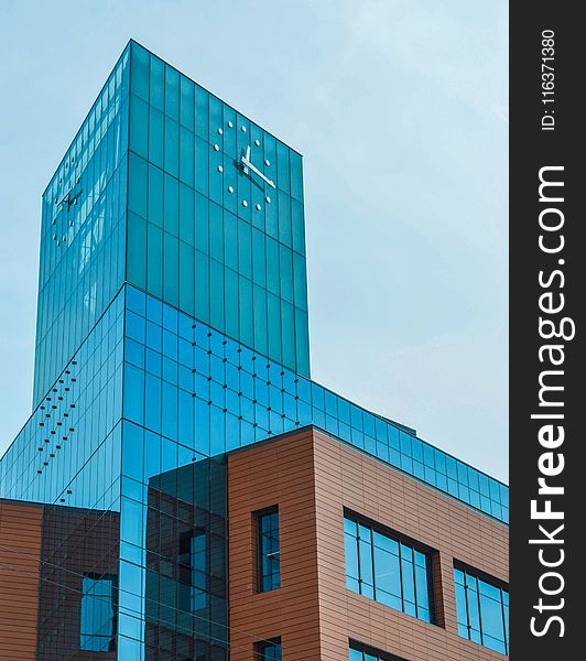 Blue Glass Building With Clock