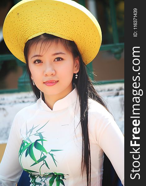 Woman Wearing White Long-sleeved Shirt and Yellow Hat