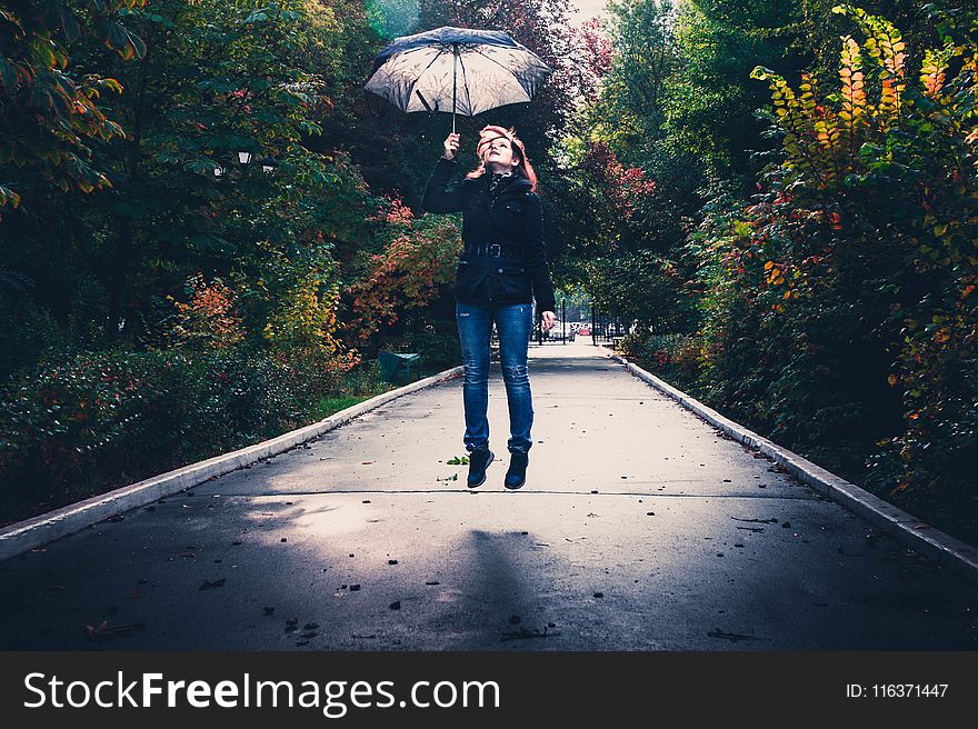 Woman Holding Gray Umbrella