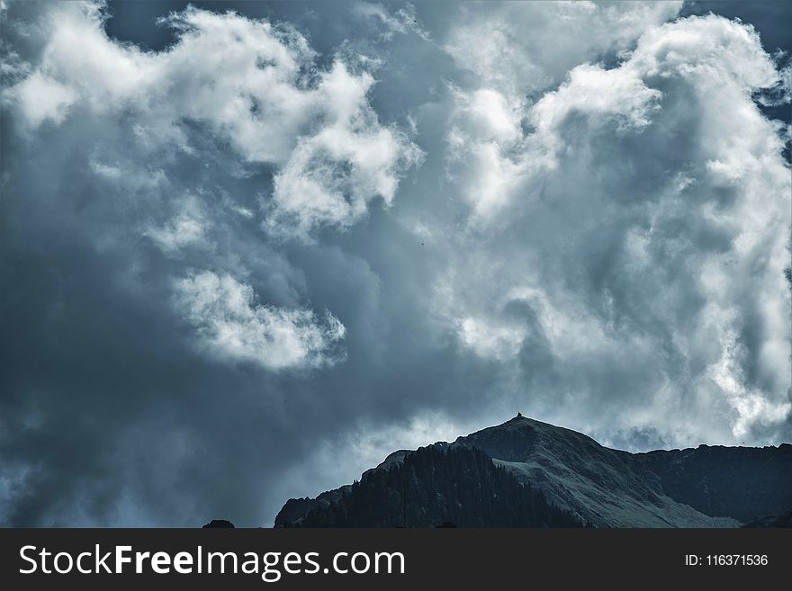 Photo of Cloudy Sky Under Mountain