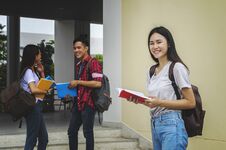 Young Asian Woman Student And Friends Are Tutoring Exam With Stu Royalty Free Stock Image
