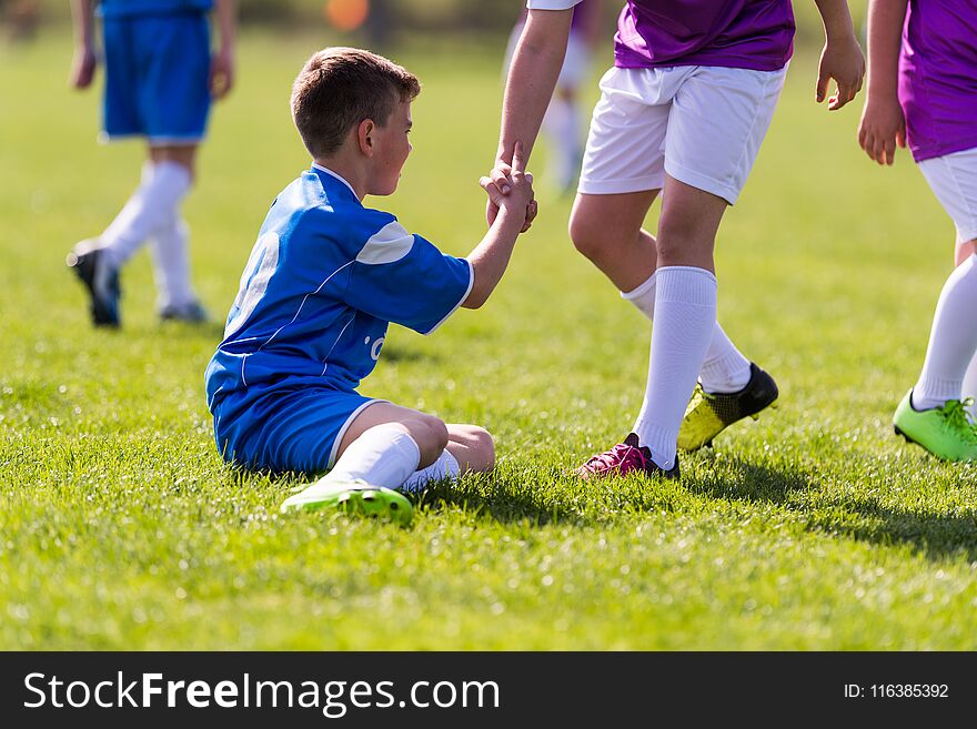 Young children players football match on soccer field