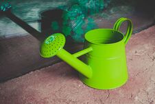 Watering Can On The Garden Close Up Shoot. Photo Depicts Bright Stock Photo