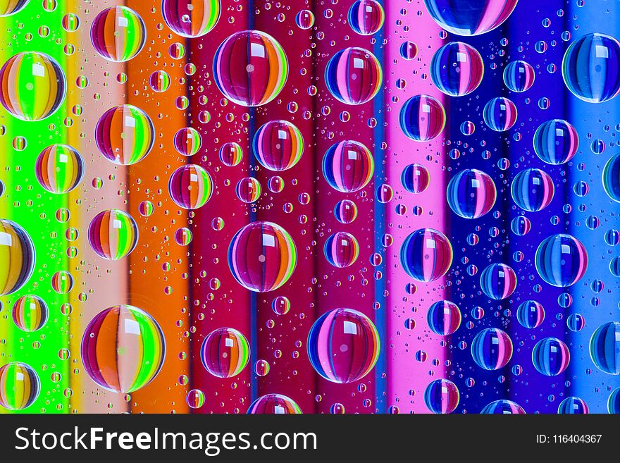 Color abstract background with drops and wooden pencils set