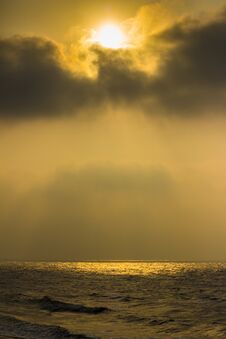 Golden Sunrise Sunset Twilight Hour. Sun Rays Reflecting On Sea Water And Shore. Stock Photos
