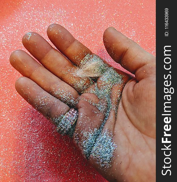 Person Holding Grey Glitter