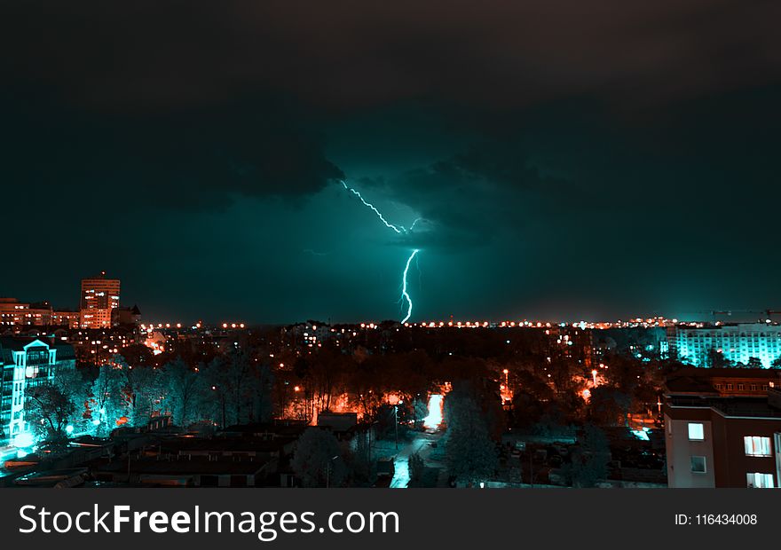 Aerial View of City With Thunder
