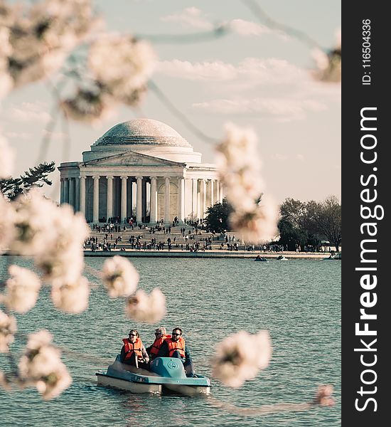 People Riding Pedal Boat