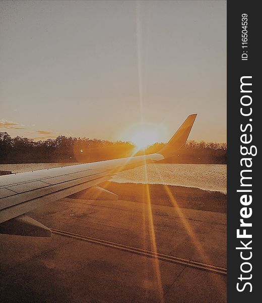 Photo of Airplane Wing during Golden Hour