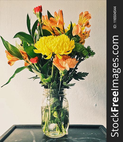 Yellow Mums, Orange Peruvian Lilies, and Carnation Flower Arrangement