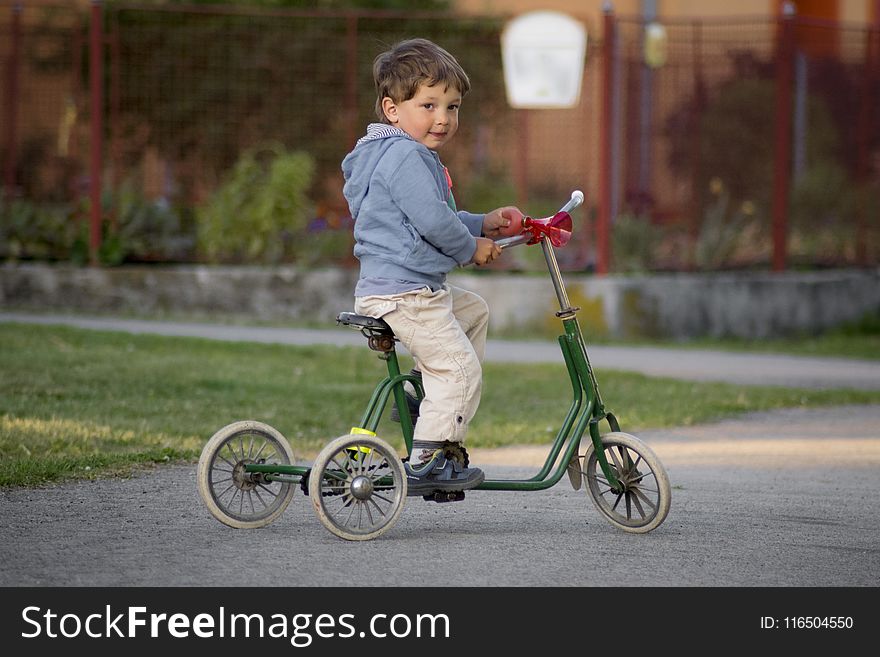 Boy Riding Green bike
