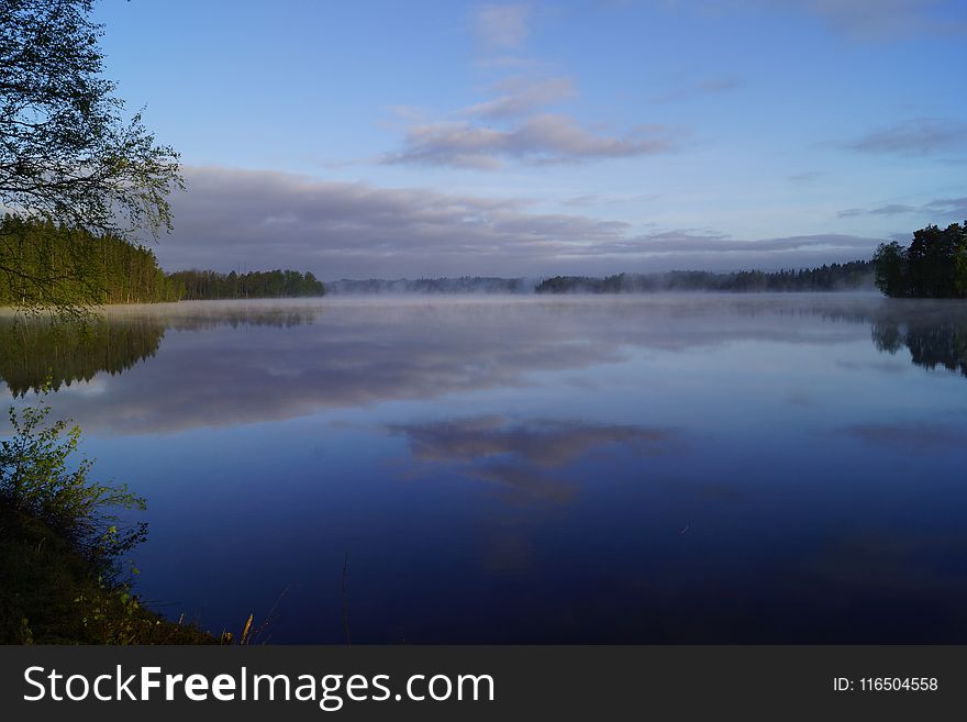 Landscape Photo of Body of Water Surrounded by Trees