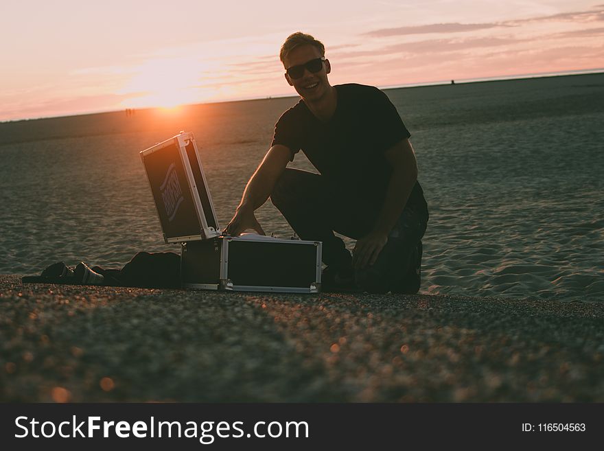 Man Near Black Flight Case