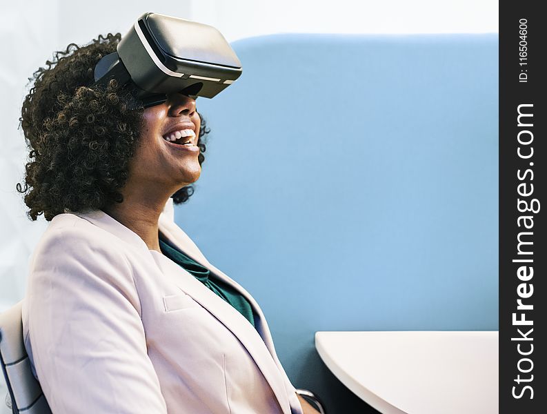 Woman Wearing White Robe And Black Virtual Reality Headset