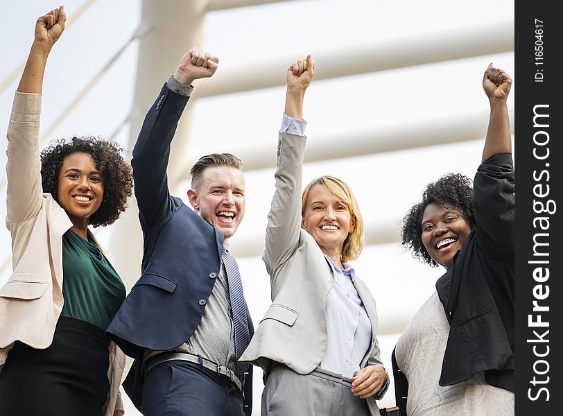 Group of People Raising Right Hand