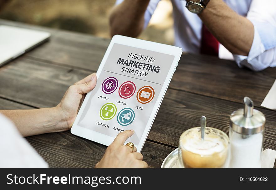 Person Holding Inbound Marketing Strategy Book