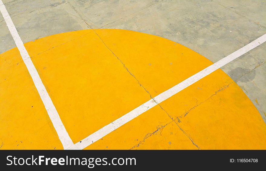 Gray Concrete Pavement With Yellow and White Paint