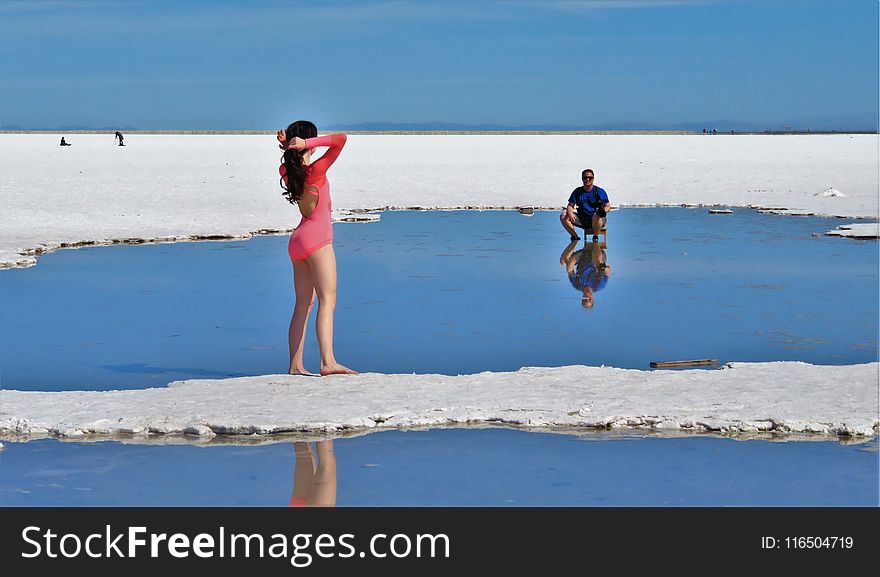 Woman In Pink Long-sleeved Swimsuit On Island