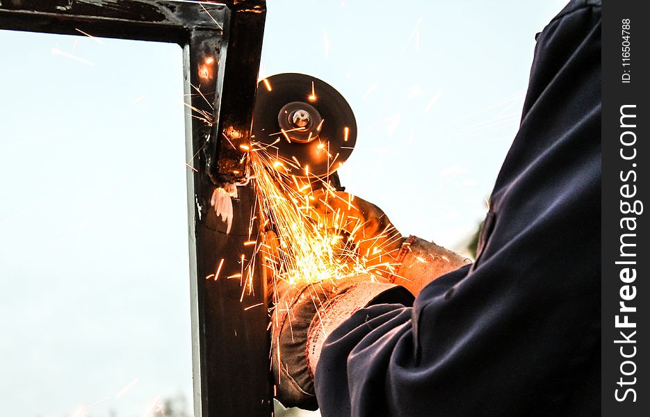 Person Holding Angle Grinder