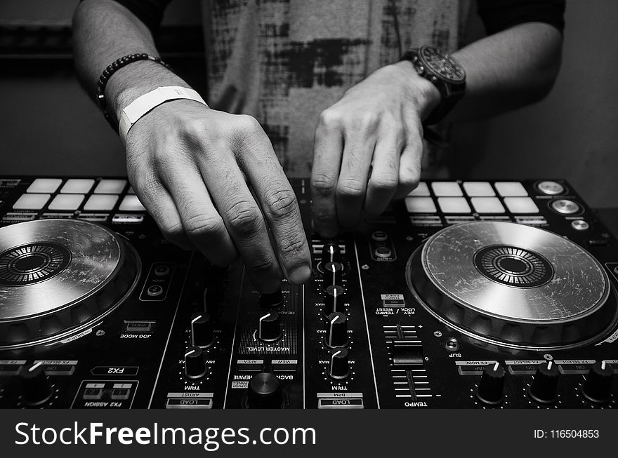 Grayscale Photography of Person Using Dj Controller