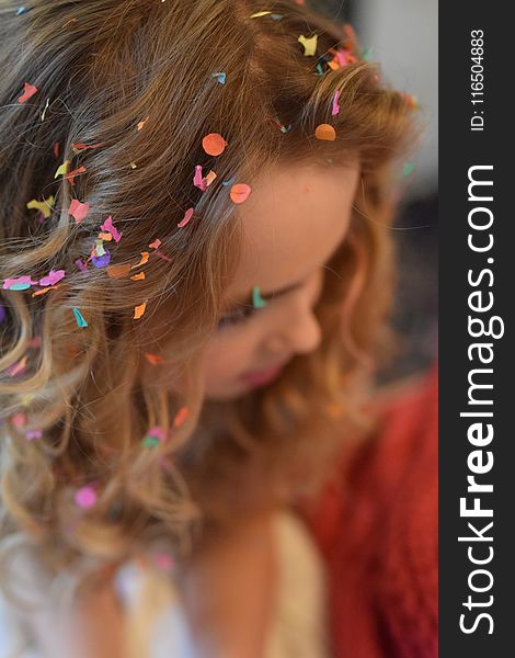 Shallow Focus Photography of Brown Haired Woman With Confetti on Hair