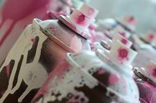 A Lot Of Dirty And Used Aerosol Cans Of Bright Pink Paint. Macro Photograph With Shallow Depth Of Field. Selective Focus On The S Stock Photo