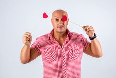 Cheerful Man In A Shirt On A White Background Holding Hearts, A Postcard For Valentine`s Day Stock Photos