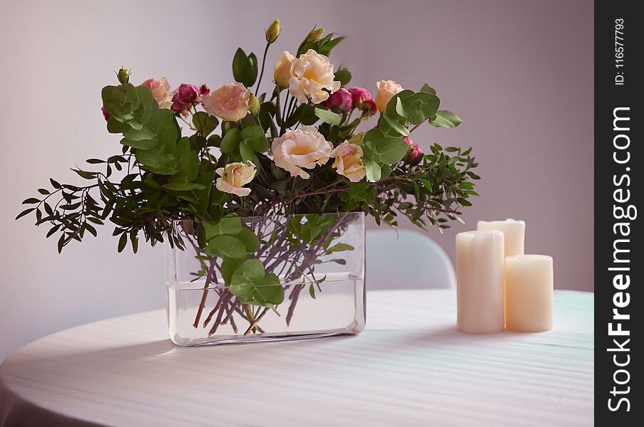 Flower arrangement on a white table. Flower arrangement on a white table