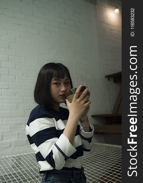 Photo Of Woman Wearing Black And White Stripe Top