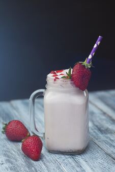 Milk Cocktail Shake Drink With Srawberry. Homemade Fruit Milkshake With Straw In Glass. Rustic Gray Wooden Background. Stock Images
