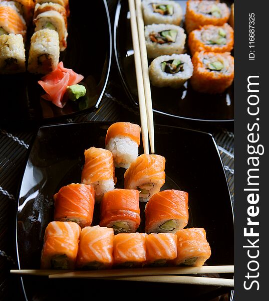 Japanese sushi on black plate, close up