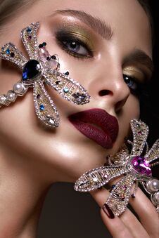 Beautiful Blonde Girl With Curls, Bright Make-up And Designer Accessories. Beauty Face. Stock Photography Beautiful Blonde Girl With Curls, Bright Make-up And Designer Accessories. Beauty Face. Stock Photography