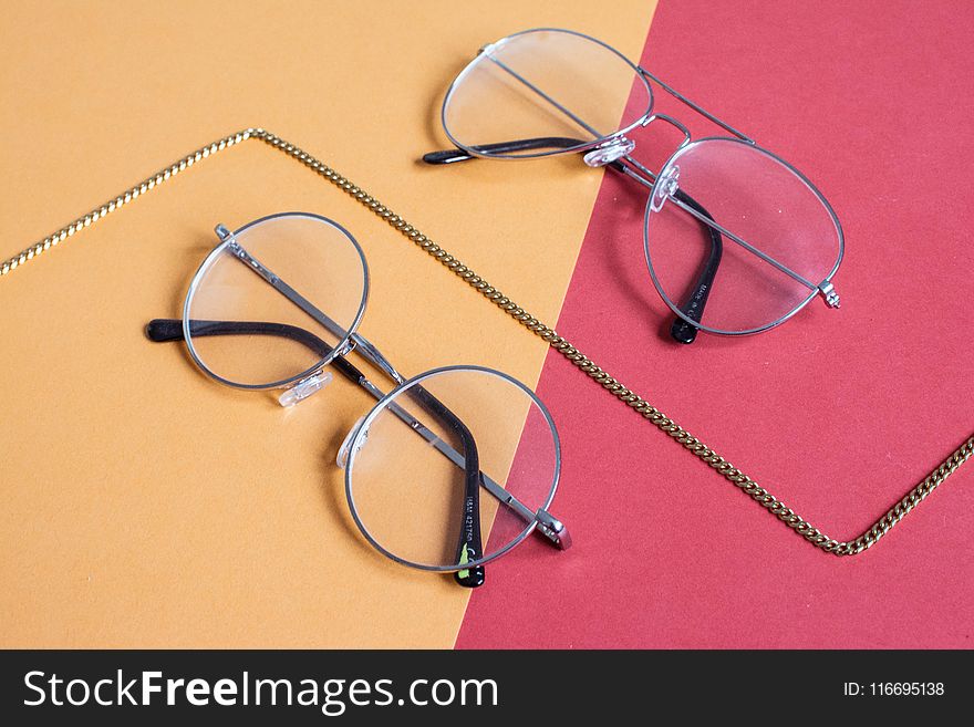 Two Clear Aviator Eyeglasses With Gray Steel Frame