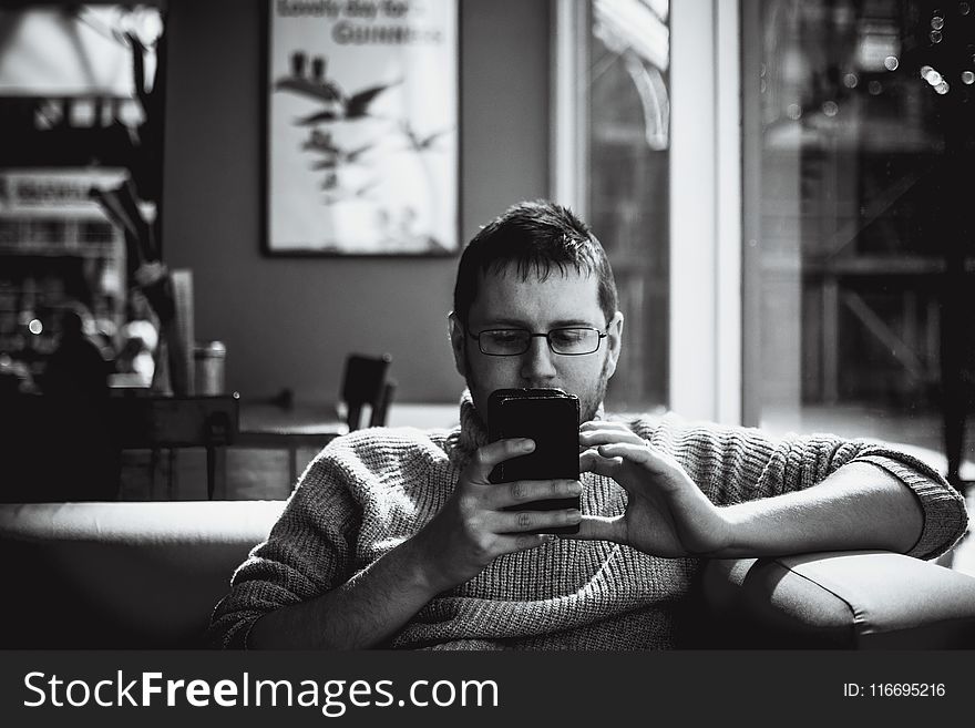 Man Holding Phone Grayscale Photography