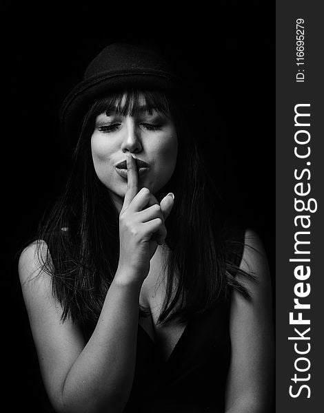 Monochrome Photography Of Woman Doing Silent Gesture