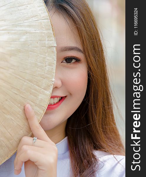 Photo Woman Hiding on Asian Conical Hat