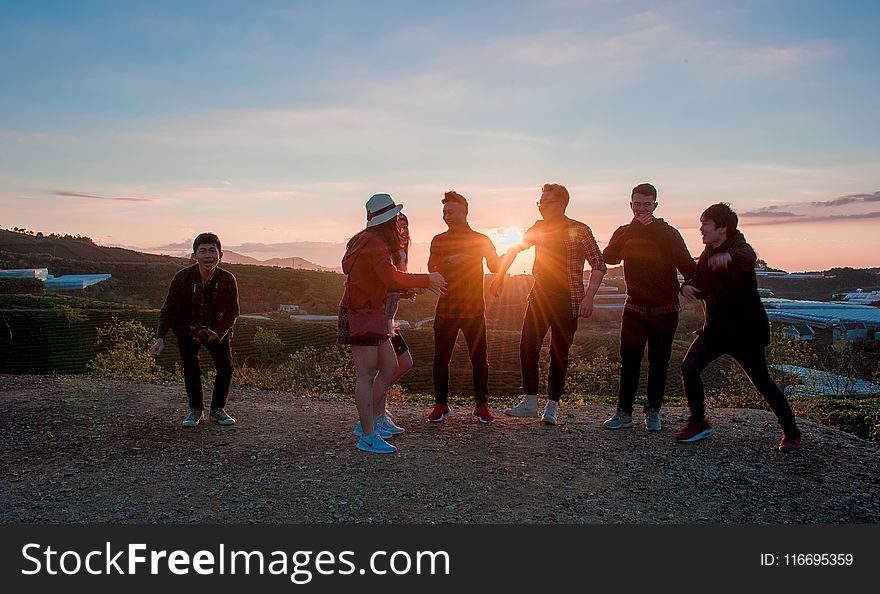 People Gathering During Sunset