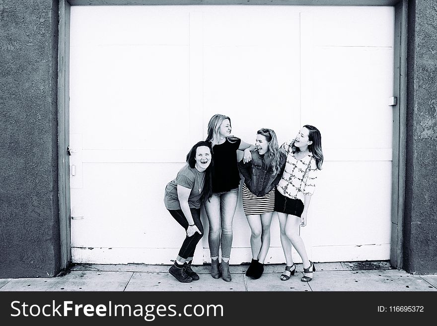 Grayscale Photography Of Four Women Wearing Clothes