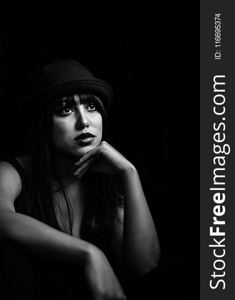 Grayscale Photo Of Woman Wearing Black Hat