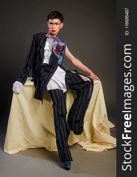 Photography Of Man Wearing Multi-colored Pinstripe Outfit