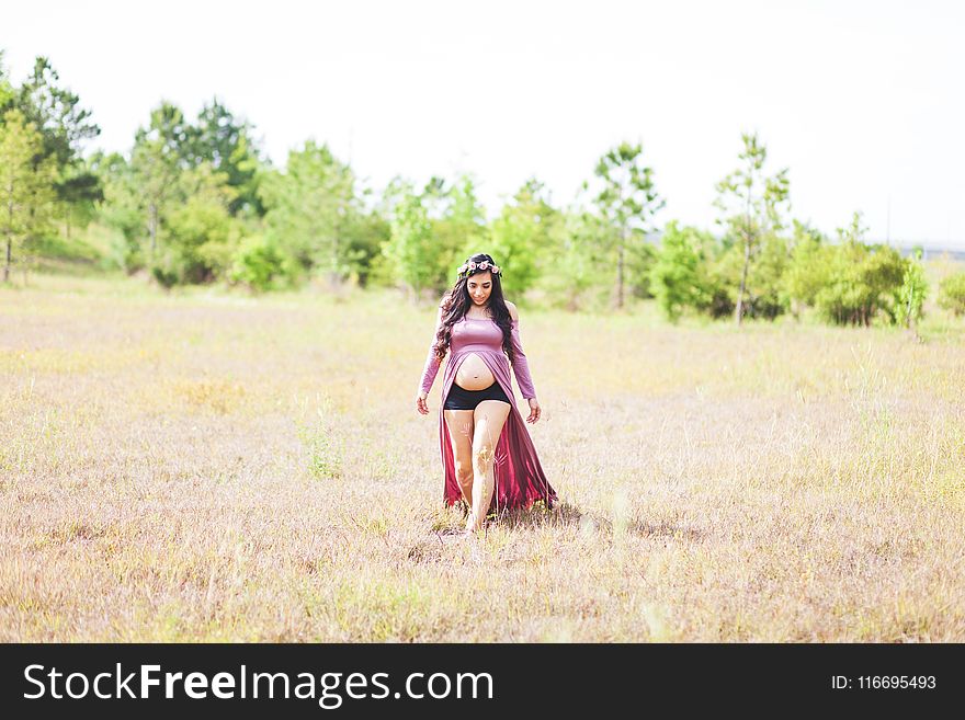 Maternity Photo Shoot of Woman Wearing Slit Front Dress