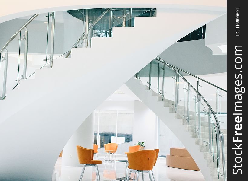 Orange Chairs Near Staircase