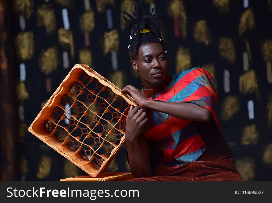Photo of Man Holding Plastic Bottle Crate